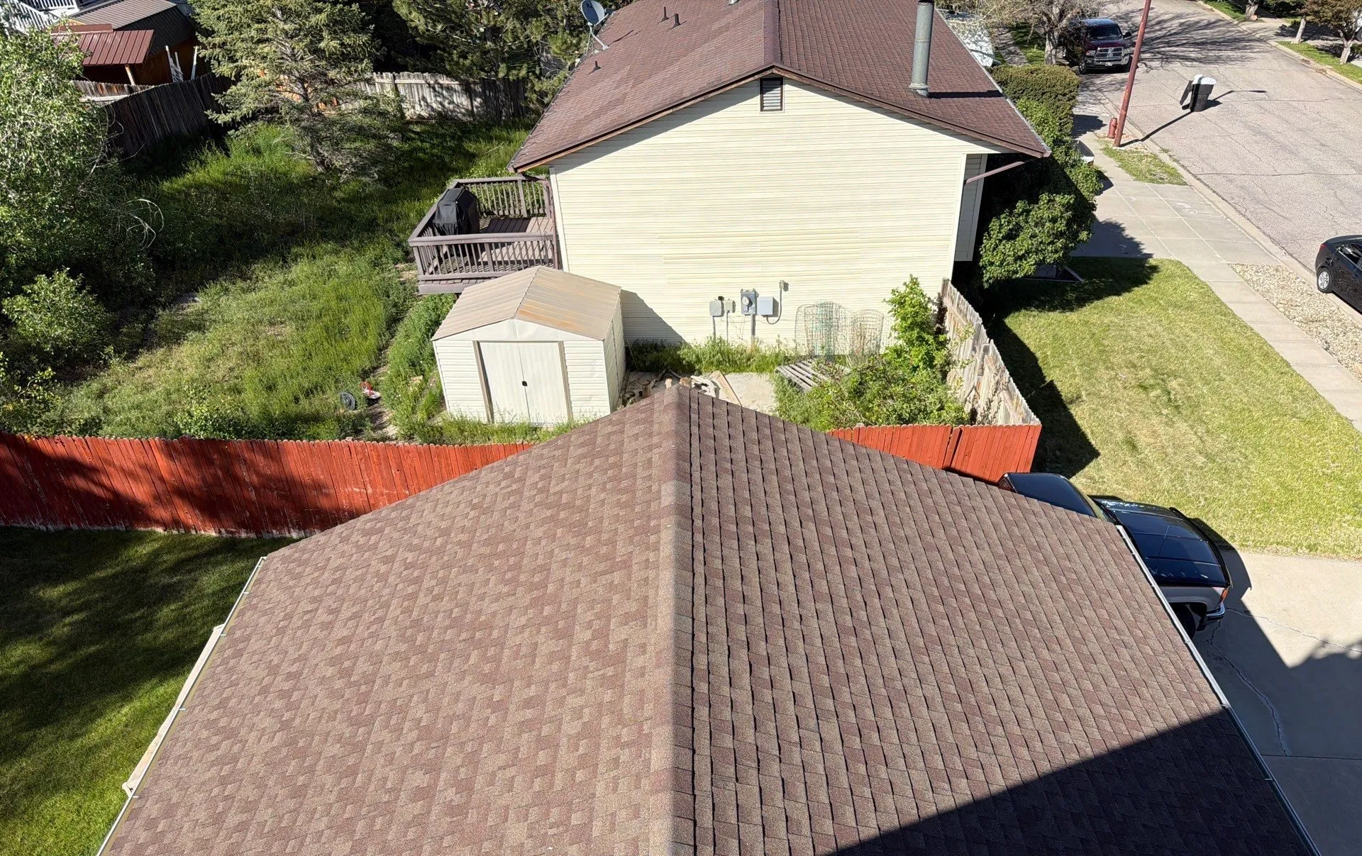 Aerial view of a finished hip roof installed by Gregco